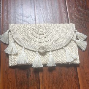 A new day tassel wrislet straw clutch